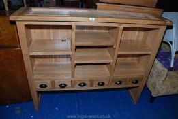 A modern kitchen dresser top with six drawers and pigeon holes. 55" long x 14" deep x 45" high.