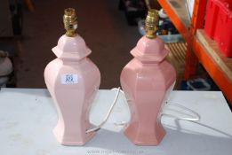 Two pink pottery table lamps.