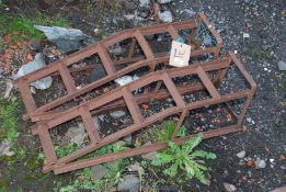 A pair of metal car ramps