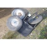 Three pneumatic wheelbarrow wheels and a grass box collector.