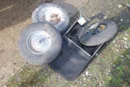 Three pneumatic wheelbarrow wheels and a grass box collector.