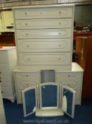 Two white finished three drawer bedside cabinets with matching five drawer chest of drawers and a