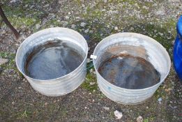 Two circular galvanized feeders,