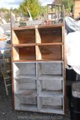 A set of 10 pine compartment shelf unit