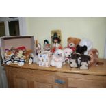 A collection of cuddly toys and costume dolls.