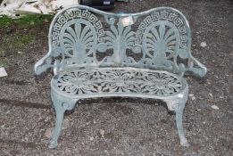 A two seated metal garden seat.