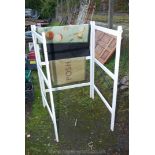 A three section painted clothes Horse and mats.