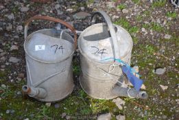 2 galvanised watering cans