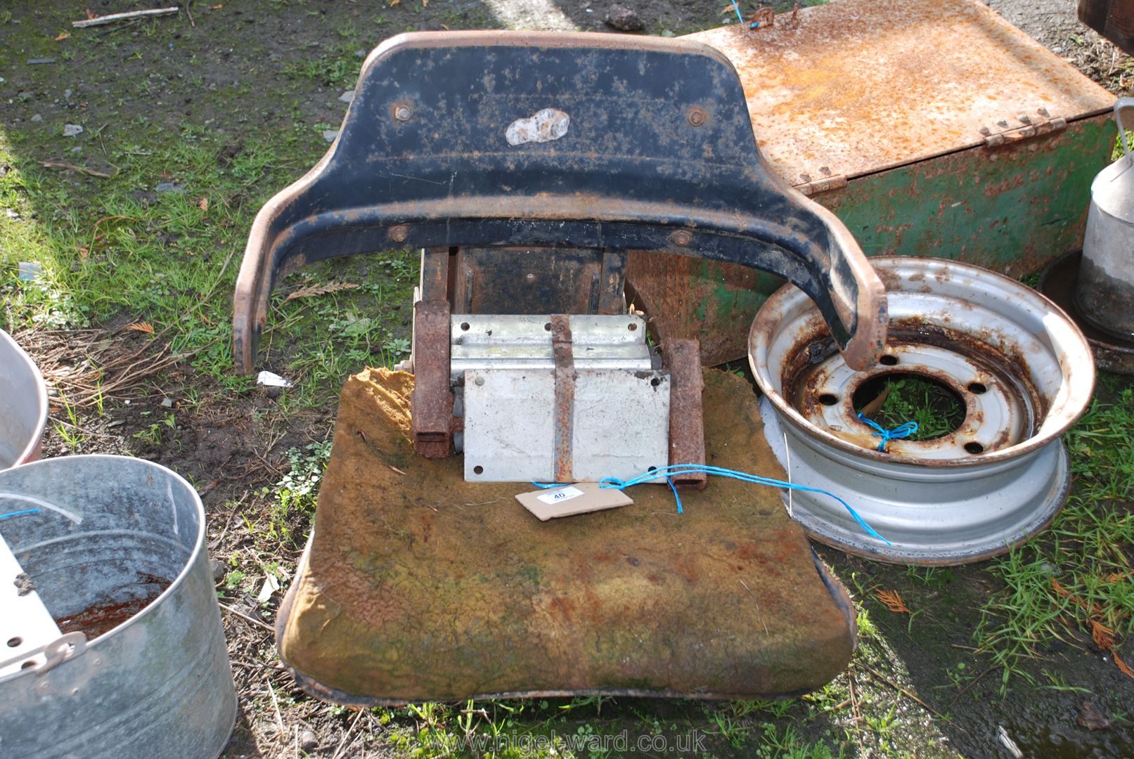 A tractor/digger seat frame and stub axles.