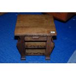 An oak side table with magazine rack and wine rack. 20" x 17 1/2" x 19" high.