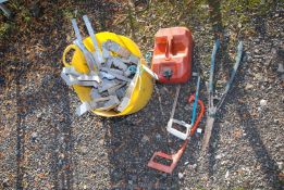A bucket of joist hangers, garden shears and fuel can.