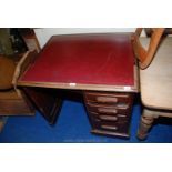 A red leather topped single pedestal office desk. 3ft long x 30" wide x 30" high.