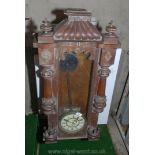 A hardwood wall hanging pendulum clock with enamel face and Roman numerals. A/F.