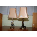 A pair of metal table lamps.