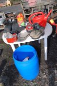 A plastic tub with lid containing hiking boots size 39, cooking tins, wellingtons,