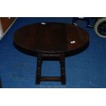 A small oak drop leaf table.