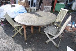 A 5" diameter wooden garden Table with five matching folding chairs.