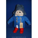A Paddington Bear with label ''Please Look after this Bear, Thank you'',