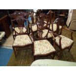 A set of eight including two carvers Hepplewhite style shield back Dining Chairs having fretworked