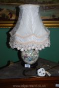 A cream lamp decorated with ducks and water plants, 11" tall, cream silk shade 17" tall.