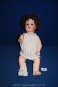 An Armand Marseille bisque headed character Doll with open and closing eyes,