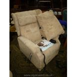 A beige upholstered Chatsworth electrically operated riser/recliner wing Fireside Armchair