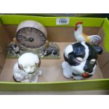 A Border Fine Arts quartz clock with dog figures, a Bonzo dog figure with removable lid,