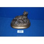 A bronzed figure of a sleeping Cat signed 'Mene', 5'' long x 3 1/2'' high.