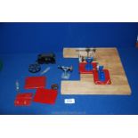 A quantity of Mamod stationary steam engine accessories.
