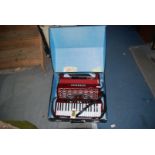 A red Guerrini 'Oxford 3' 96 bass, 4 voice Piano Accordion, in good condition,
