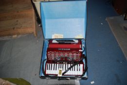 A red Guerrini 'Oxford 3' 96 bass, 4 voice Piano Accordion, in good condition,