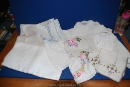 A small quantity of linen including Damask table cloths,embroidered and lace tray cloths etc.