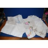 A small quantity of linen including Damask table cloths,embroidered and lace tray cloths etc.