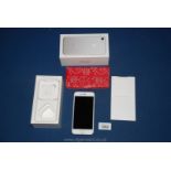 An Apple iPhone 7 32GB Silver locked to Vodafone in original box with unused Apple EarPods with