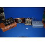 A small brown leather case, two lockable metal cash tins (with key), Metamec electric clock, etc.