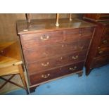 A Georgian Mahogany Chest of Drawers with brass swan-neck handles,