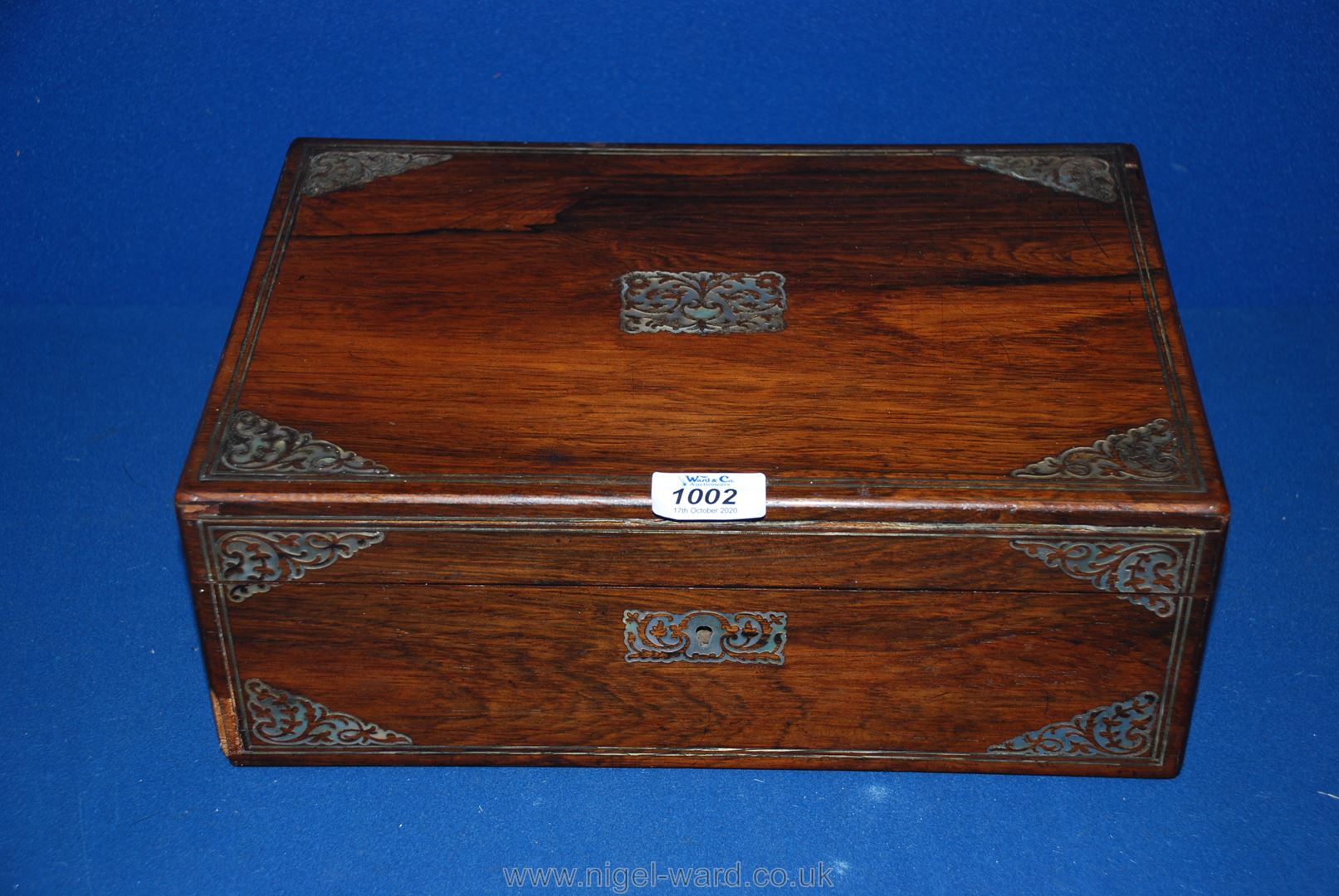 A wooden stationary box with Mother of Pearl inlay, made by Mechi of London.