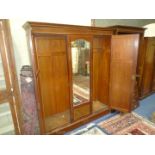 A cross banded and dark and lightwood strung, Mahogany Wardrobe with generous hanging space,