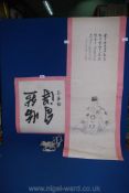 A Japanese scroll of Deity with calligraphic script, some foxing and repairs, mounted on paper,