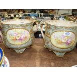 A pair of Bonn Germany Jardinieres in duck egg blue and gold with floral panel.