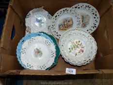 A quantity of Ribbon plates decorated with fruit, flowers and cherubs, etc.