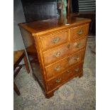 A nice quality TV and Video cabinet representing a cross-banded Mahogany and Walnut Chest of three