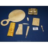 A box of ivory oddments, parasol etc.