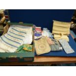 A box of patchwork squares, upholstery edging, etc.