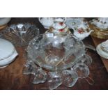A glass Punch Bowl having 12 punch cups and a plastic ladle, bowl 12 1/2" diameter.