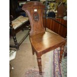 A circa 1900 Mahogany solid seated hall Chair having reeded/shell carved top rail,
