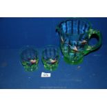 A Victorian green glass hand painted flying ducks water jug and two tumblers.