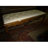 A Satinwood show framed two seater Stool having carved shell and scroll detail to the friezes,