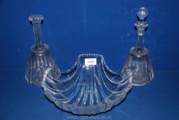 A large lead crystal scalloped shell shaped bowl and two decanters, one stopper missing.