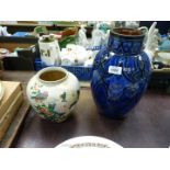 Two oriental Vases, one blue ground, 13 1/2" tall and the other decorated with birds and flowers,